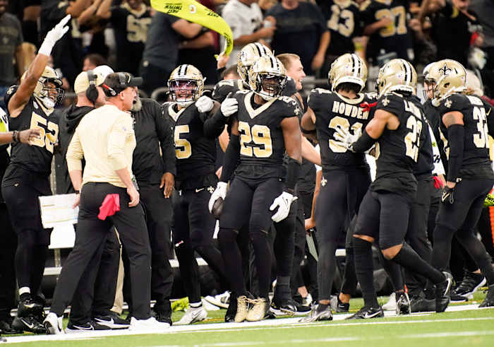 New Orleans Saints cornerback Paulson Adebo (29) celebrates intercepting a Titans pass